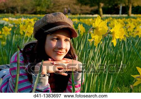 Stock Photo - cool girl portrait teenager spring daffs. Fotosearch