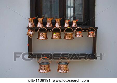 Stock Image - Copperware at Samovodska Chorshia the old market now heritage site central Veliko Tarnovo central Bulgaria Balkans Europe. Fotosearch