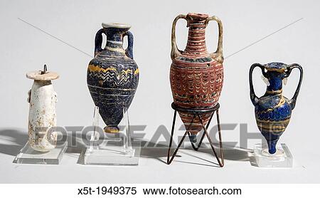 Stock Photography - Core-formed Glass vessels 4-5th century BCE From left to right Alabastron, Amphoriskos, Amphoriskos and Amphora.. Fotosearch