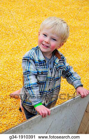 Stock Image - Corn-fed kid. Fotosearch