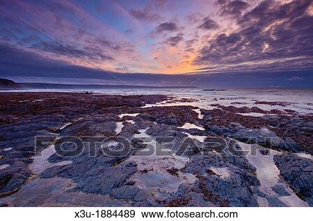 Stock Photo - Cornborough Range at Dusk on the North Devon Coast, Abbotsham, England, United Kingdom. Fotosearch