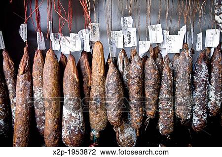 Stock Image - Corsican traditional sausages in a tent city of St-Florence tourist, France, Europe.. Fotosearch
