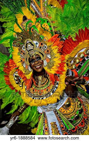 Picture - Costumed dancers celebrate the New Year with the Junkanoo Parade on January 1, 2013 in Nassau, Bahamas The carnival like festival is celebrated in the early hours of the New Year lasting until the late morning and dates back to slavery days. Fotosearch