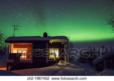 Cottage with northern light, aurora borealis in background in winter time at Riksgr? nsen in swedish lapland. View Large Photo Image Stock Image - Cottage with northern light, aurora borealis in background in winter time at Riksgr? nsen in swedish lapland.. Fotosearch