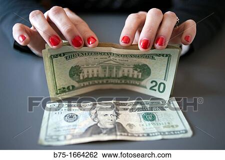 Stock Image - Counting money. Fotosearch