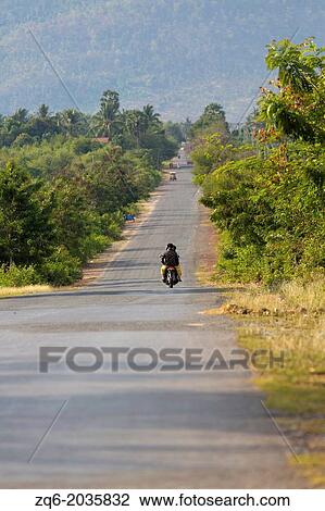 Stock Image - Country Road in the Province of Kampot, Cambodia.. Fotosearch