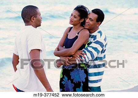couple and a friend talk at the beach View Large Photo Image Stock Image - couple and a friend talk at the beach. Fotosearch