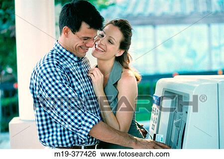 couple at a bank cash machine View Large Photo Image Stock Photograph - couple at a bank cash machine. Fotosearch