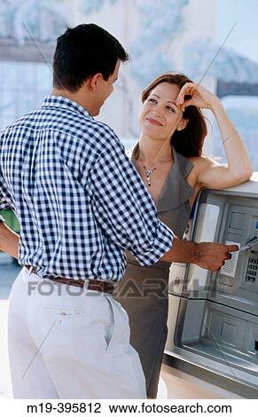 couple at an ATM machine View Large Photo Image Stock Image - couple at an ATM machine. Fotosearch