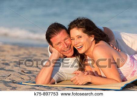 Couple at beach View Large Photo Image Stock Image - Couple at beach. Fotosearch