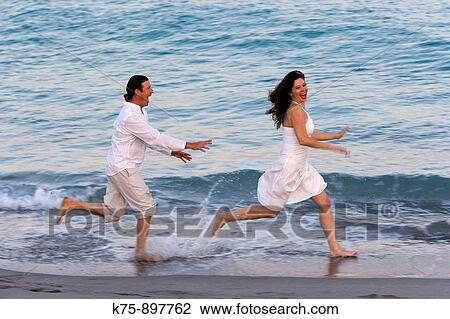 Couple at beach View Large Photo Image Stock Image - Couple at beach. Fotosearch