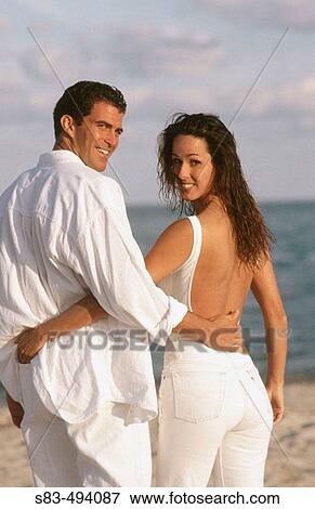 Couple at beach View Large Photo Image Stock Photo - Couple at beach. Fotosearch