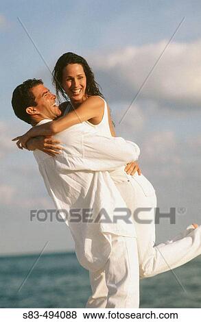 Couple at beach View Large Photo Image Stock Photo - Couple at beach. Fotosearch