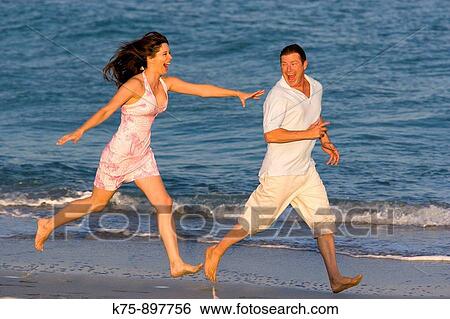 Couple at beach View Large Photo Image Stock Photograph - Couple at beach. Fotosearch