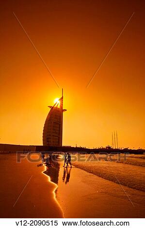 Couple At Burj Al Arab Hotel Beach Sunset Dubai United Arab Emirates Middle East Stock Photography