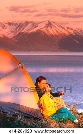 Stock Image - Couple at camp above Turnagain Arm. Chugach State Park. Alaska. Fotosearch
