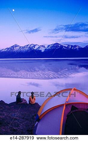 Stock Photo - Couple at camp above Turnagain Arm. Chugach State Park. Alaska. Fotosearch