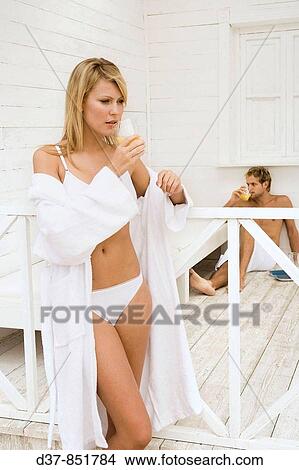 Couple at home drinking fruit juice in the morning View Large Photo Image Picture - Couple at home drinking fruit juice in the morning. Fotosearch