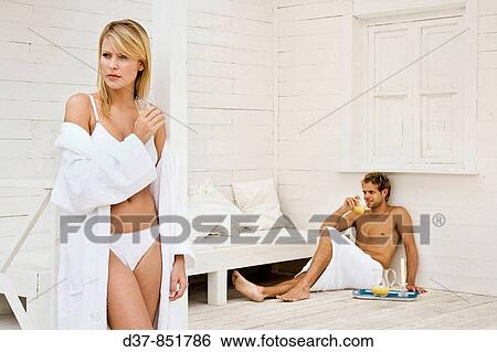 Couple at home drinking fruit juice View Large Photo Image Stock Photograph - Couple at home drinking fruit juice. Fotosearch