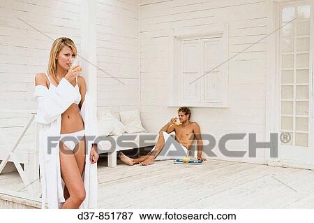 Couple at home drinking orange juice View Large Photo Image Stock Photo - Couple at home drinking orange juice. Fotosearch