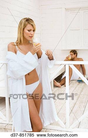 Couple at home drinking orange juice View Large Photo Image Stock Photography - Couple at home drinking orange juice. Fotosearch