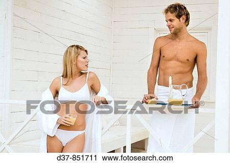 Stock Image - Couple at home having breackfast. Fotosearch