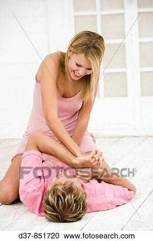 Stock Image - Couple at home joking. Fotosearch