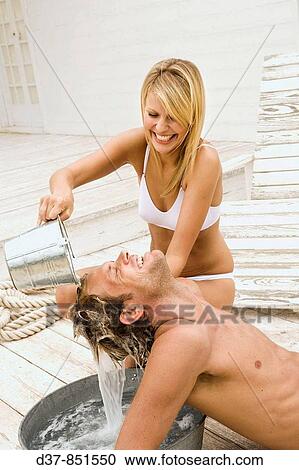 Couple at home washing hair View Large Photo Image Stock Image - Couple at home washing hair. Fotosearch