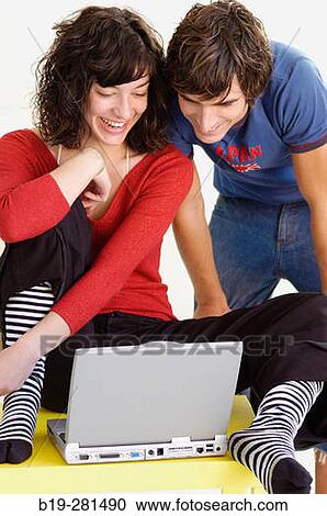 Couple at home with laptop View Large Photo Image Stock Image - Couple at home with laptop. Fotosearch