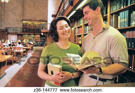 Couple at library View Large Photo Image Stock Photo - Couple at library. Fotosearch