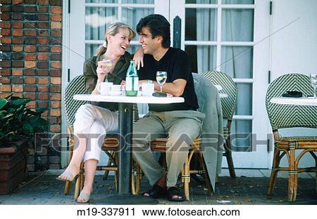 Couple at outdoor caf? View Large Photo Image Stock Image - Couple at outdoor caf?. Fotosearch