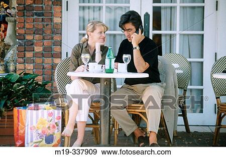 Couple at outdoor caf? View Large Photo Image Stock Photo - Couple at outdoor caf?. Fotosearch
