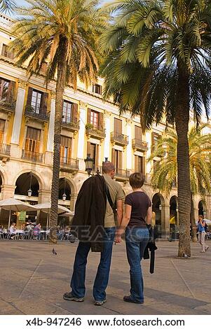 Couple at Placa Reial square in Barri Gotic district of Barcelona Spain Europe View Large Photo Image Stock Photograph - Couple at Placa Reial square in Barri Gotic district of Barcelona Spain Europe. Fotosearch
