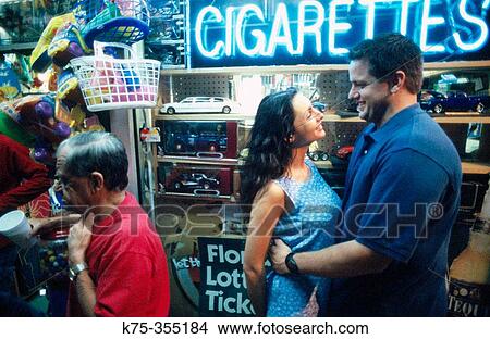 Couple at shop View Large Photo Image Picture - Couple at shop. Fotosearch