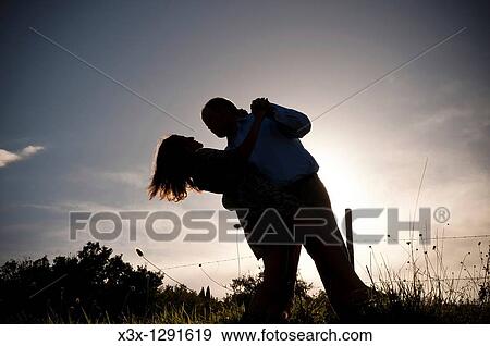 Stock Photo - Couple at sunset in Tuscany Italy. Fotosearch