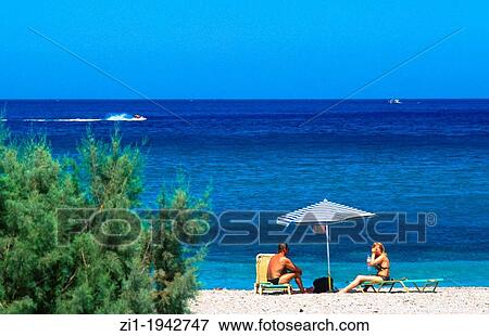 couple at the beach at Karpathos island, Greece View Large Photo Image Stock Photo - couple at the beach at Karpathos island, Greece. Fotosearch