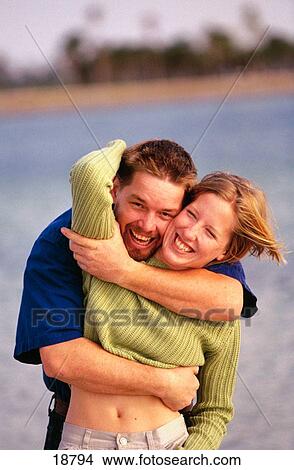 Couple at the beach View Large Photo Image Picture - Couple at the beach. Fotosearch