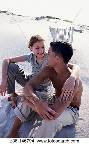 Couple at the beach View Large Photo Image Picture - Couple at the beach. Fotosearch