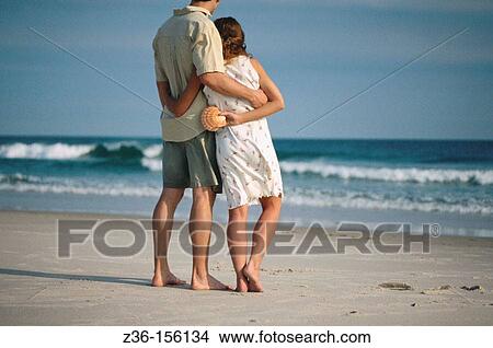 Couple at the beach View Large Photo Image Picture - Couple at the beach. Fotosearch