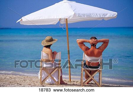 Couple at the beach View Large Photo Image Stock Image - Couple at the beach. Fotosearch