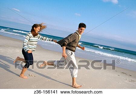 Couple at the beach View Large Photo Image Stock Image - Couple at the beach. Fotosearch