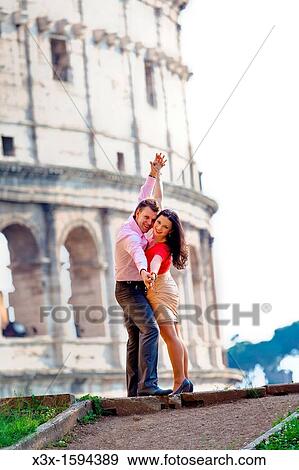 Stock Photo - Couple at the Roman Coliseum Rome Italy. Fotosearch