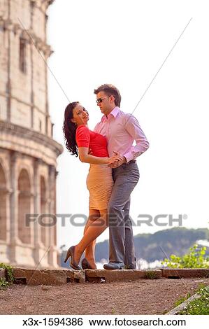 Stock Photograph - Couple at the Roman Coliseum Rome Italy. Fotosearch
