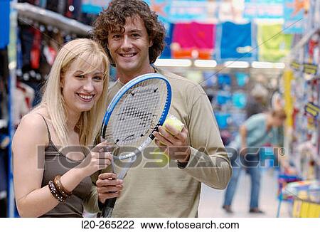 Couple at the sports section of a shopping center View Large Photo Image Stock Image - Couple at the sports section of a shopping center. Fotosearch