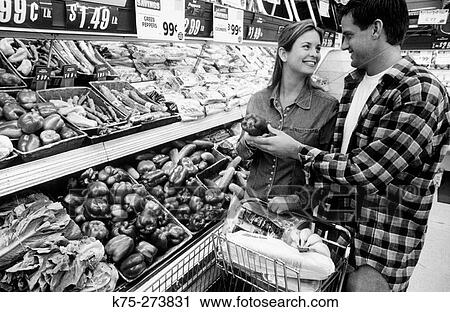 Couple at the supermarket View Large Photo Image Stock Image - Couple at the supermarket. Fotosearch