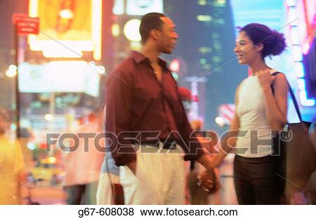 Couple at Times Square. New York City. USA View Large Photo Image Stock Photo - Couple at Times Square. New York City. USA. Fotosearch