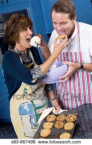 Couple baking in the kitchen. View Large Photo Image Stock Photo - Couple baking in the kitchen.. Fotosearch