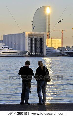 Stock Image - Couple. Barcelona port. Catalonia. Spain.. Fotosearch