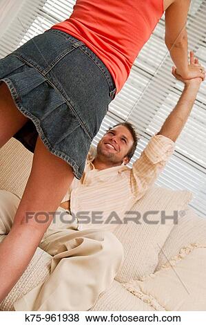 couple being playful on couch View Large Photo Image Stock Photo - couple being playful on couch. Fotosearch