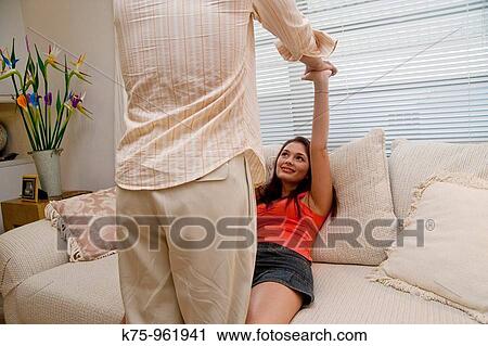 couple being playful on the couch View Large Photo Image Stock Image - couple being playful on the couch. Fotosearch